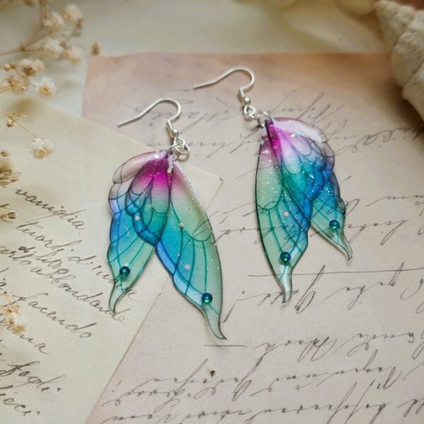 boucles d'oreilles ailes de fée sirène argent 925 bleu et rose , avec des paillettes enchantées, en résine transparente et flexible